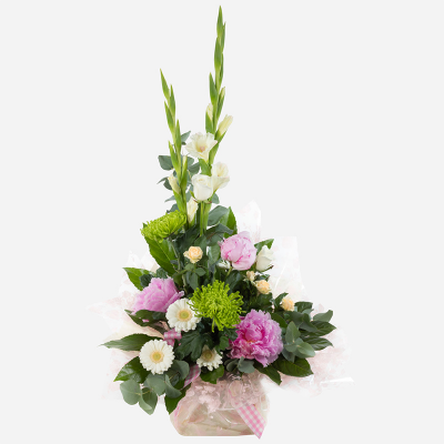 High Rise  - This stunning arrangement is sure to inspire flower lovers everywhere. Featuring bold and beautiful peonies along with a harmonious selection of complementary flowers.
